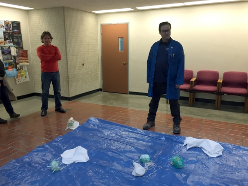 2 team members stand around the landing zone for the egg drops.